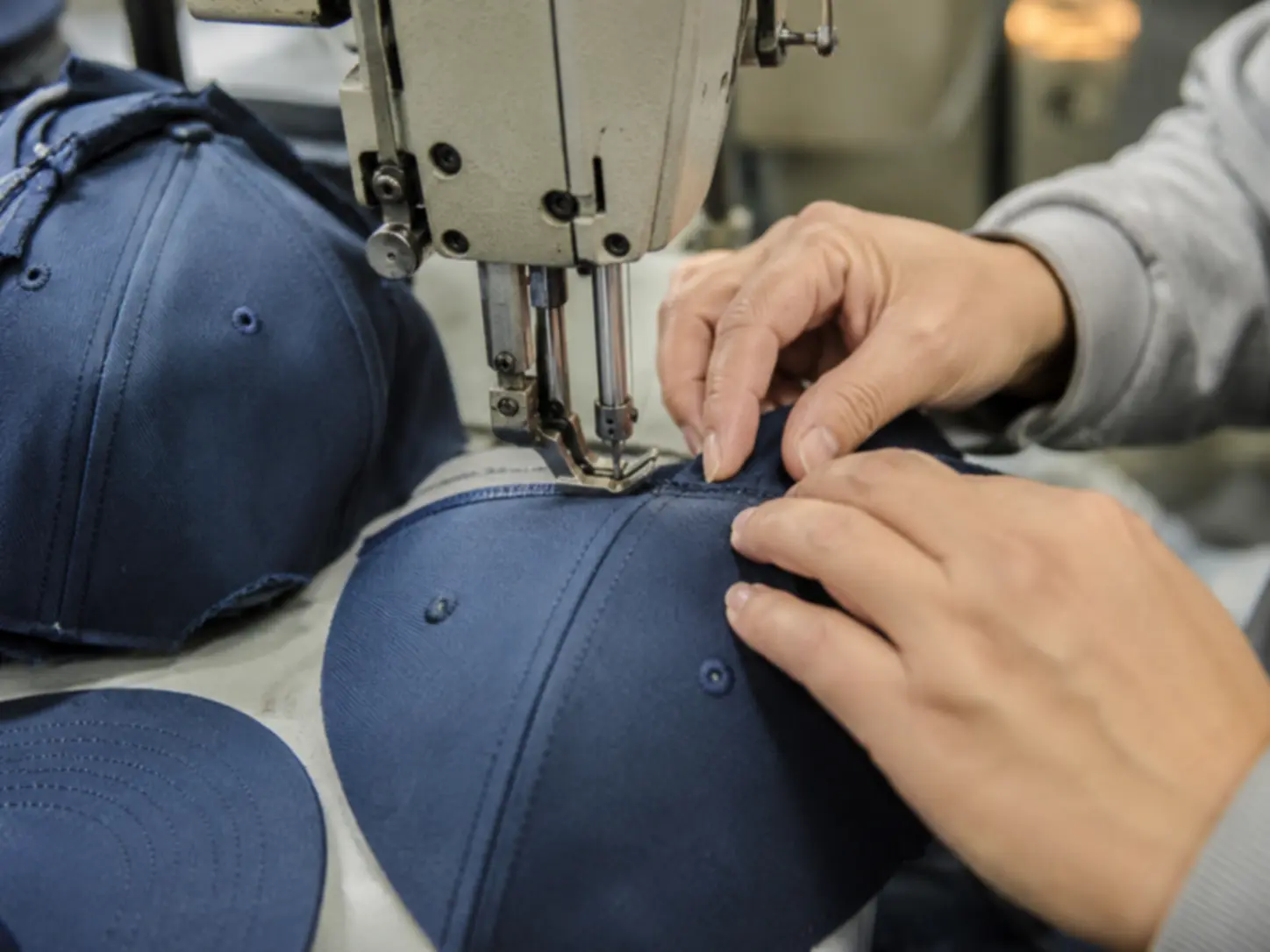 Custom hat sewing and production detail in factory